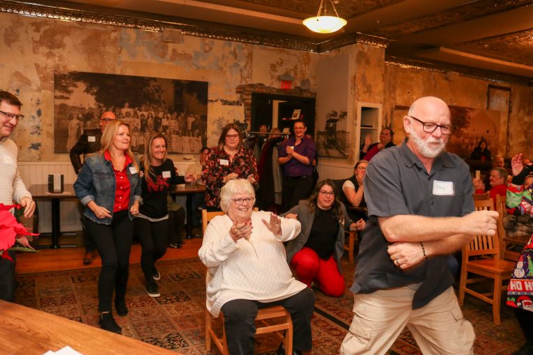 Staff performing a dance at the Staff Recognition event 2023.