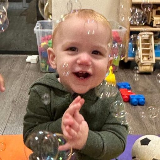 Child Playing with bubbles, at The Oaks Early Learning Child Care