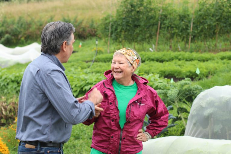 MP Tim Louis and Our Farm Coordinator Jenny Weickert talking together outside at Our Farm.