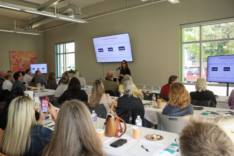 Nadia Venafro from the Canada Mortgage and Housing Corporation (CMHC) presenting to guests.