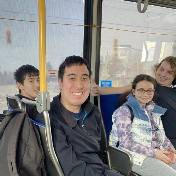YEP Social crew smiling while sitting on the Grand River Transit (GRT) bus.