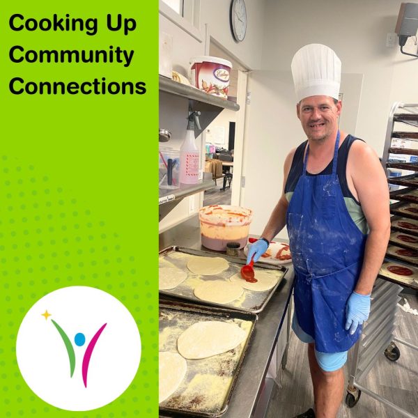 Cooking Up Community Connections! David making pizzas and smiling wearing a blue apron and white chef hat.