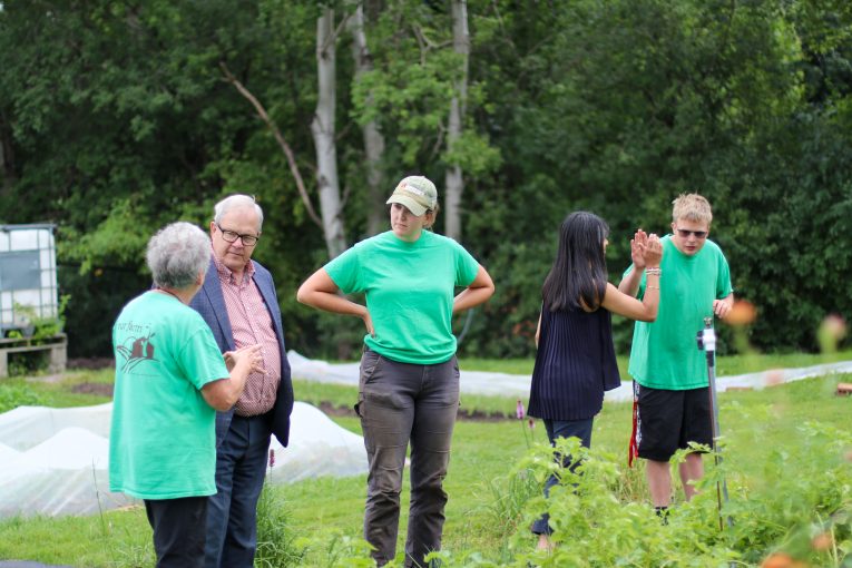 (Pictured from left to right) Our Farm Coordinator Jenny Weickert, the Minister of Agriculture the Honourable Lawrence Mac Aulay, Our Farm farmer Laura Bredschneider, MP Bardish Chagger and Our Canada Summer Jobs (CSJ) staff member Cooper Fraser Moore taking a tour of Our Farm.