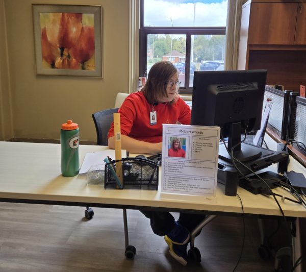 Robert working on the computer at his internship at the Cambridge Memorial Hospital.