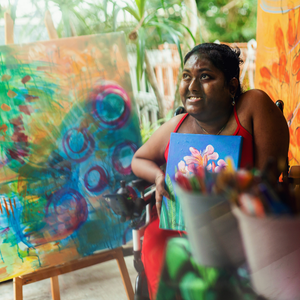 A person displaying their art that they painted