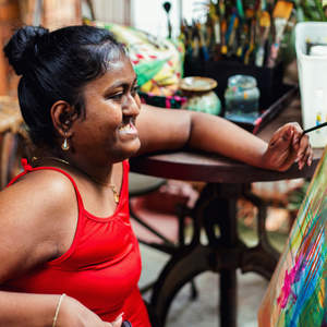 A happy person doing a craft