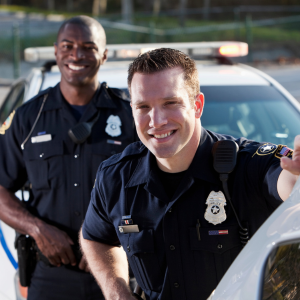 Two friendly police officers smiling