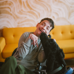 A person enjoying the company of a dog.