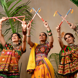 The performers wearing bright coloured Indian styled clothing