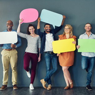 a group of people holding up speech bubbles