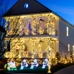 an old building with lots of holiday lights on them