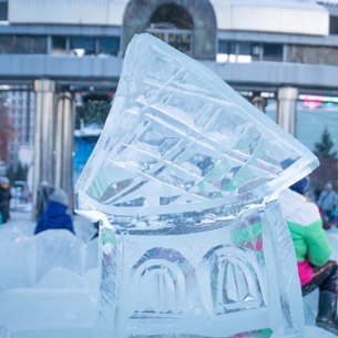 An ice sculpture of some sort of building or tower.
