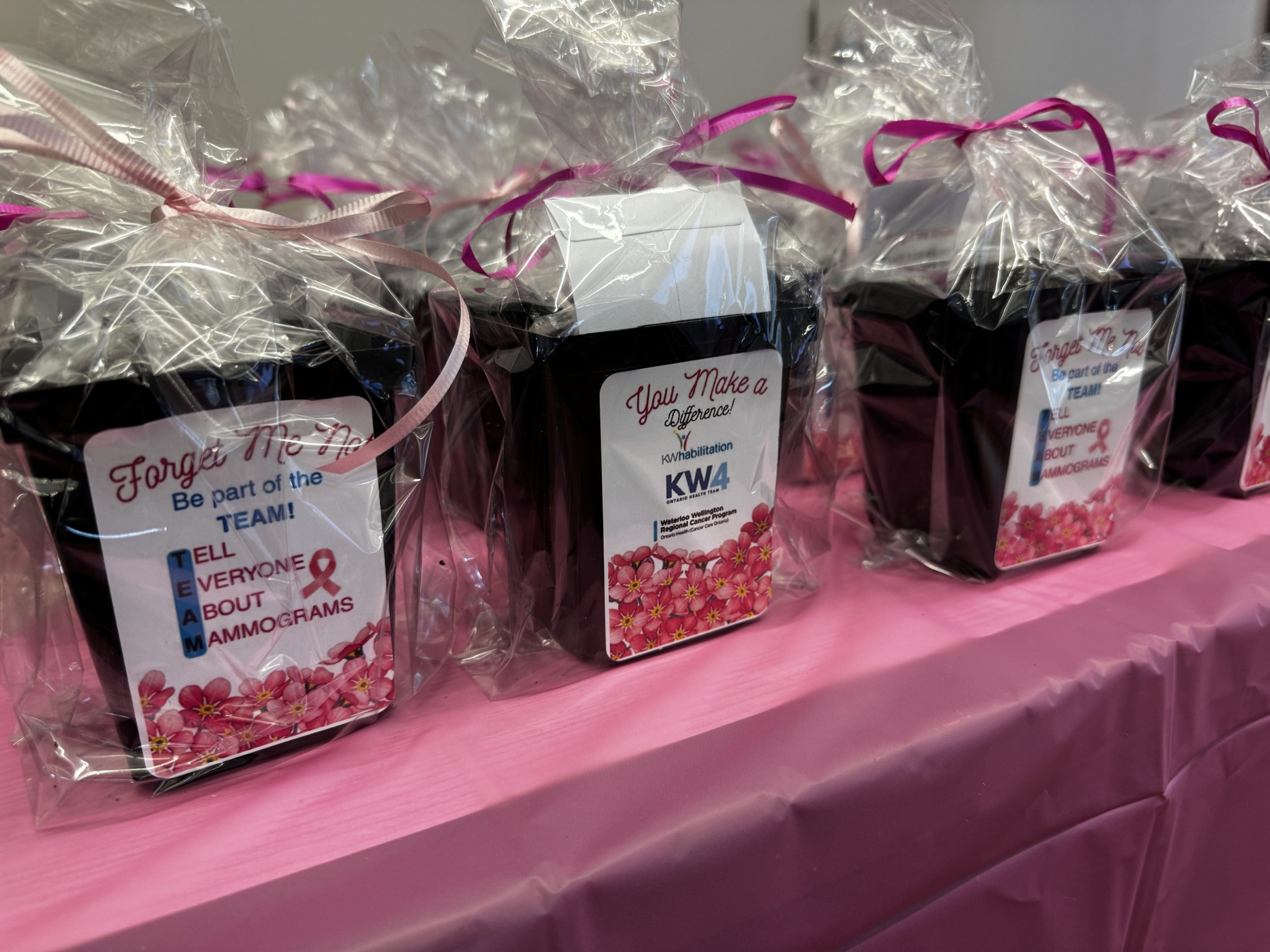 breast cancer screening swag, a pot of forget me not seeds