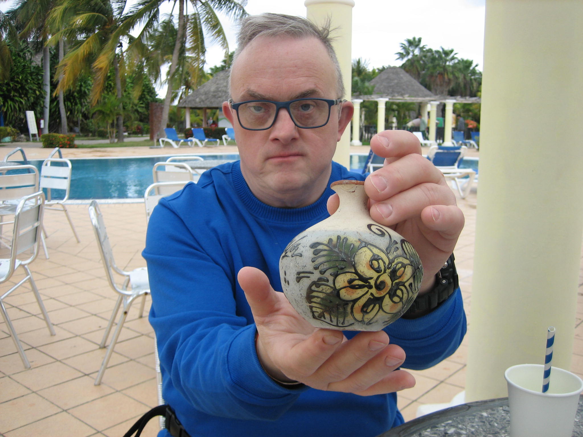 photo of Sean with a piece of pottery at a resort in Cuba