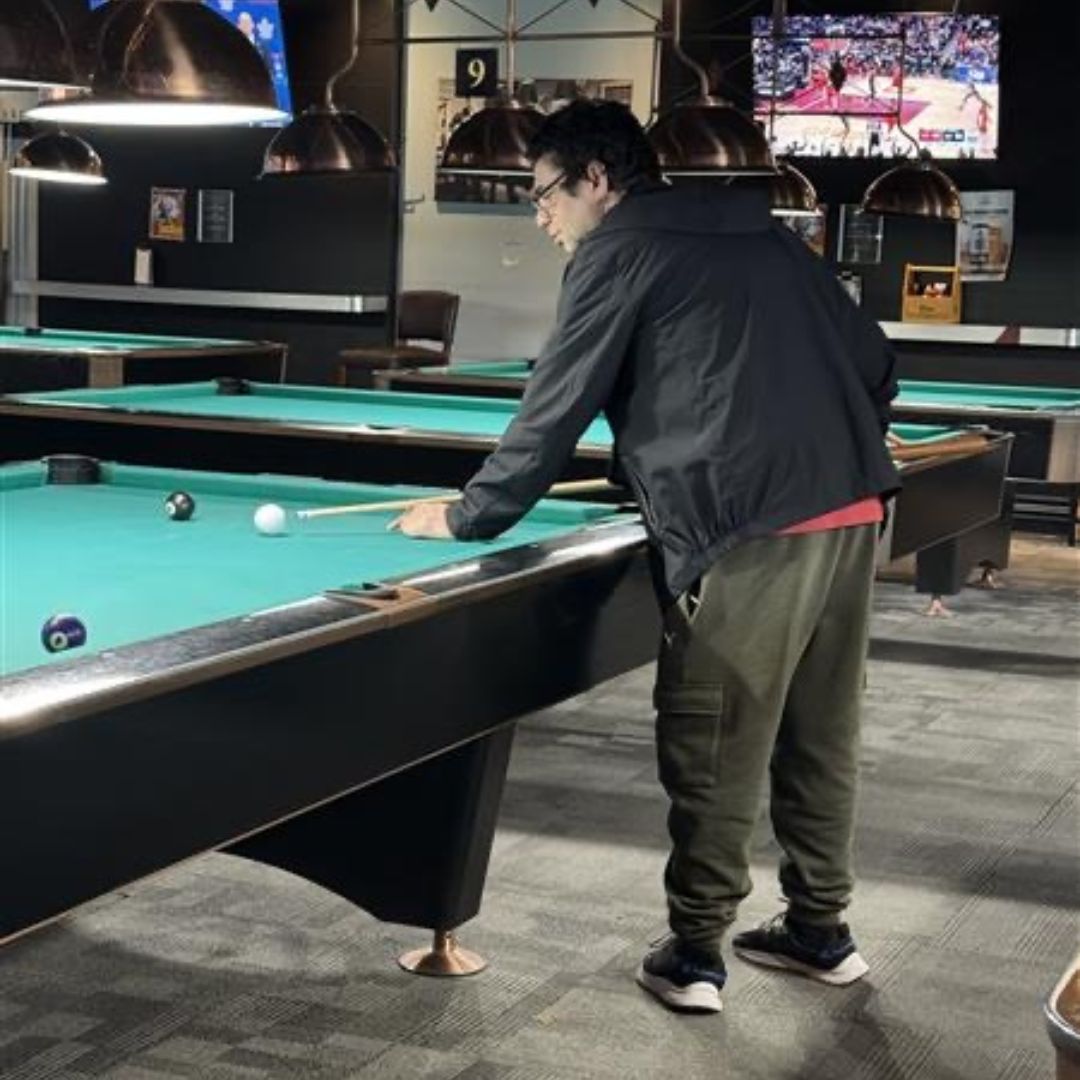man playing pool